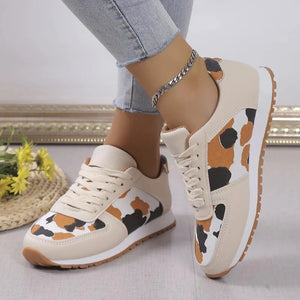 Leopard print panel runner sneakers in beige with brown, black, and white accents.