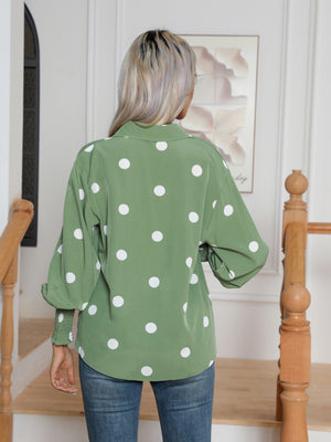 Light green polka dot blouse with shirred cuffs and balloon sleeves.