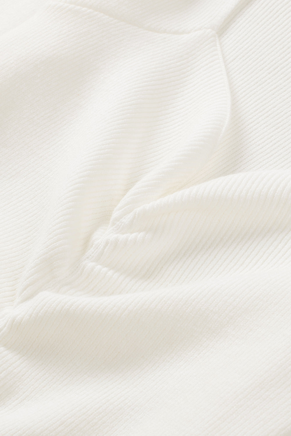 Ivory ribbed knit top with ruched front detail