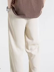 Men's off-white relaxed fit drawstring sweatpants with a casual, comfortable look.