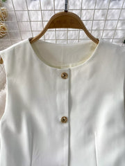 White belted two-piece set with gold button detail and pockets