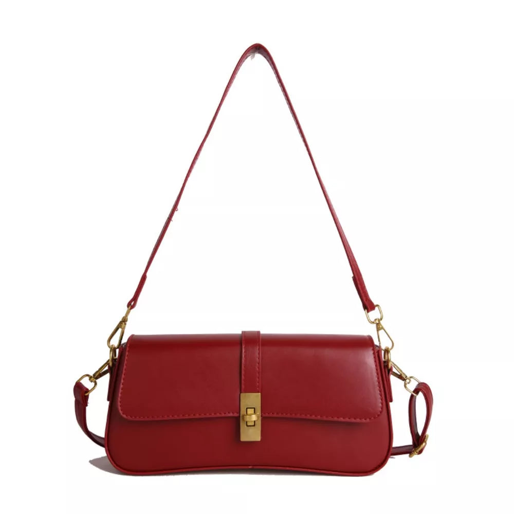 Red rectangular crossbody bag with gold clasp and adjustable strap