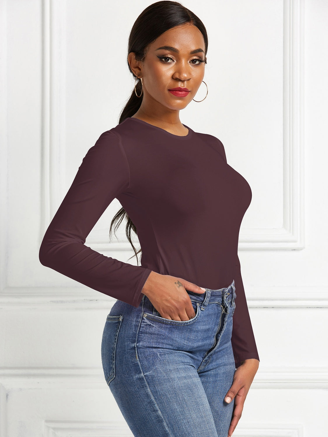 Sculpted ribbed jersey bodysuit in burgundy with long sleeves and crew neck.