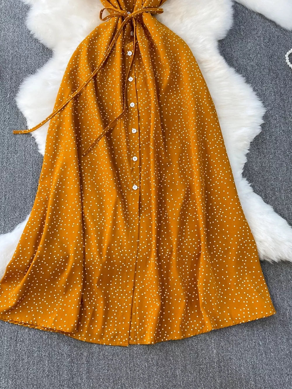Dark Yellow polka dot maxi dress with button front and belt.
