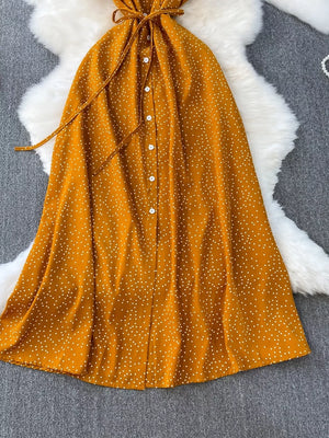 Dark Yellow polka dot maxi dress with button front and belt.