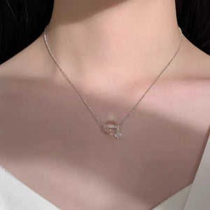 Luminous crystal pendant necklace in silver with delicate chain and cubic zirconia accent.