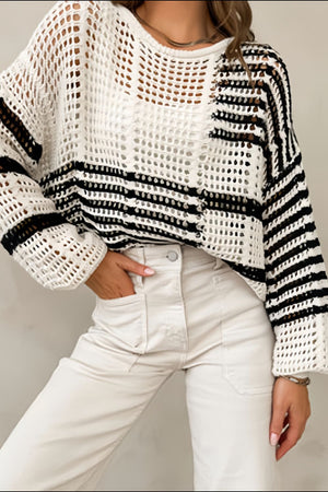 White crochet knit pullover sweater with black stripes and balloon sleeves.