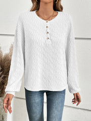 White textured henley blouse with blouson sleeves and button detail
