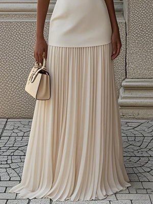Elegant cream sleeveless top with pleated maxi skirt set, boat neck, flowing skirt.