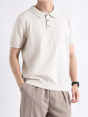Beige cotton blend short-sleeve polo with button detail and classic collar.