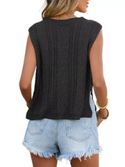 Black chevron knit sleeveless sweater vest with cable knit details.