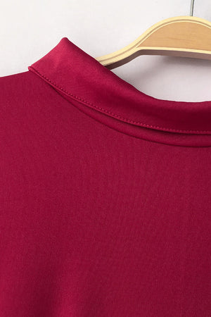 Deep Red high-neck belted palazzo jumpsuit detail showing collar and fabric texture.