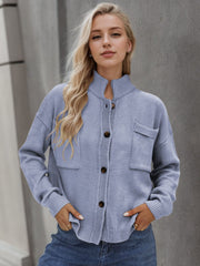 Light Blue acrylic knit cardigan with stand collar, buttons, and two chest pockets.