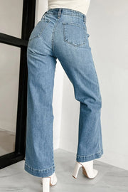 Button-fly wide-leg denim trousers in medium wash, featuring a high waist and flared hem.