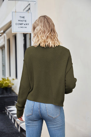 Moss green textured knit cropped cardigan with button detail.