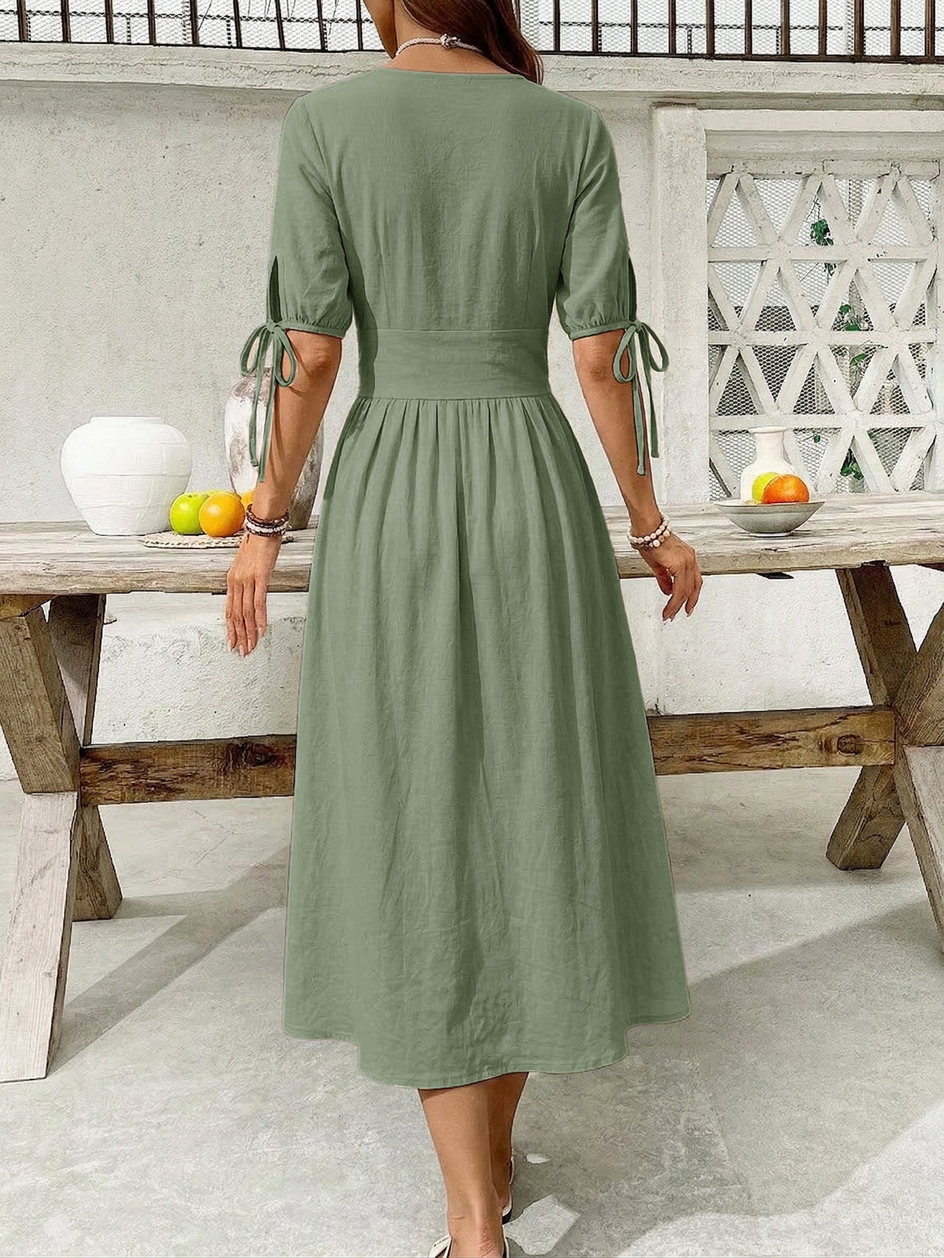 Sage button-down midi dress with tie sleeve details and a-line skirt