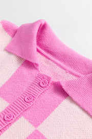 Checkered polo neck knit sweater in fuchsia pink with button front detail.
