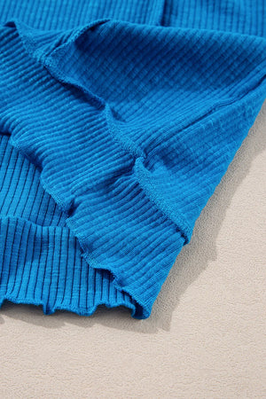 Textured sky blue thermal top with cutout neckline detail.