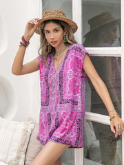 Bohemian print cap-sleeve playsuit in red-violet with button front and V-neck.