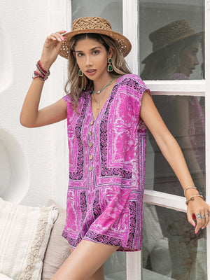 Bohemian print cap-sleeve playsuit in red-violet with button front and V-neck.