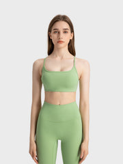 Strappy back active crop top in Yellow-Green with a square neckline.