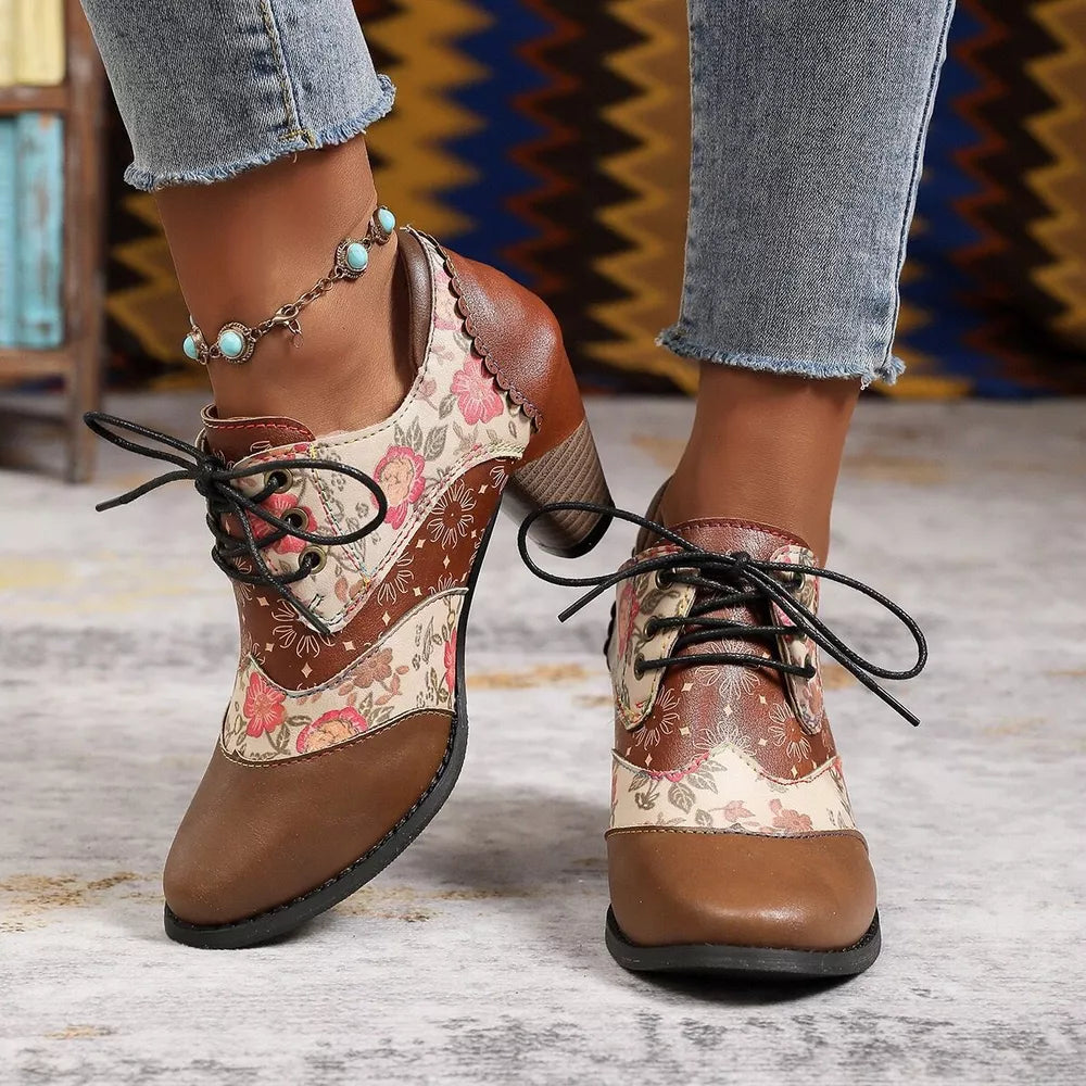 Floral patchwork lace-up ankle boots in brown with a scalloped collar and block heel.