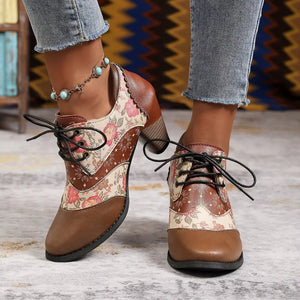 Floral patchwork lace-up ankle boots in brown with a scalloped collar and block heel.