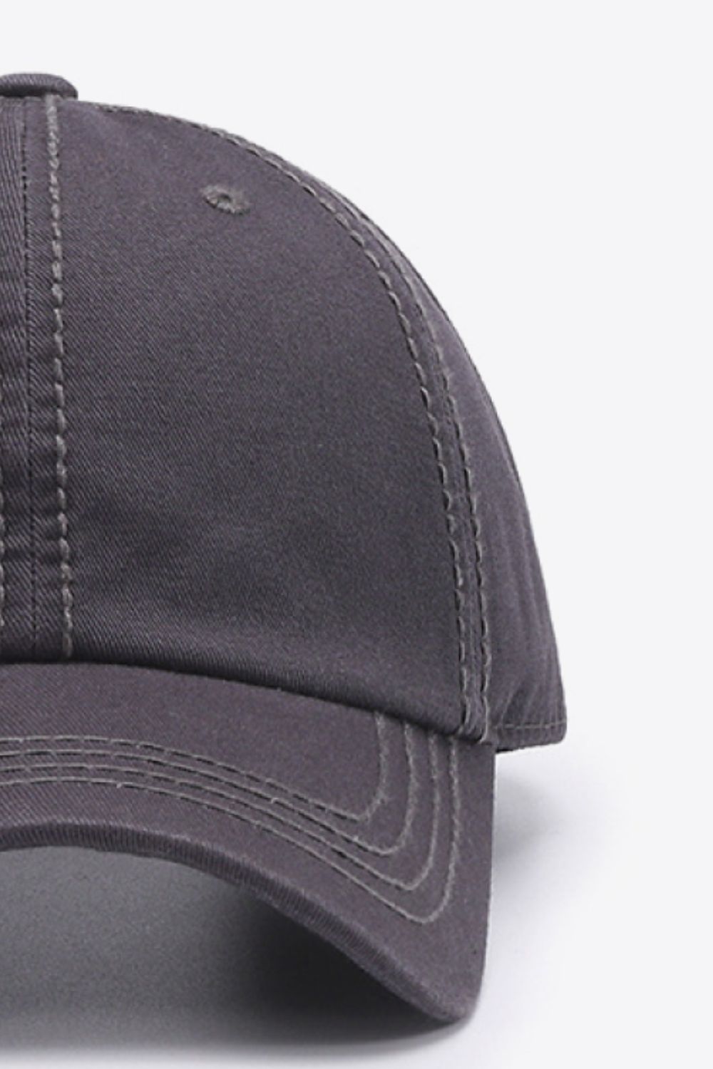 Dark gray canvas baseball cap with contrast stitching and curved brim.