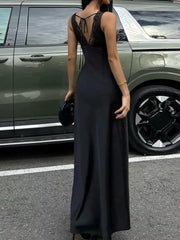 Black lace-trimmed sleeveless maxi gown with tie-back detail.