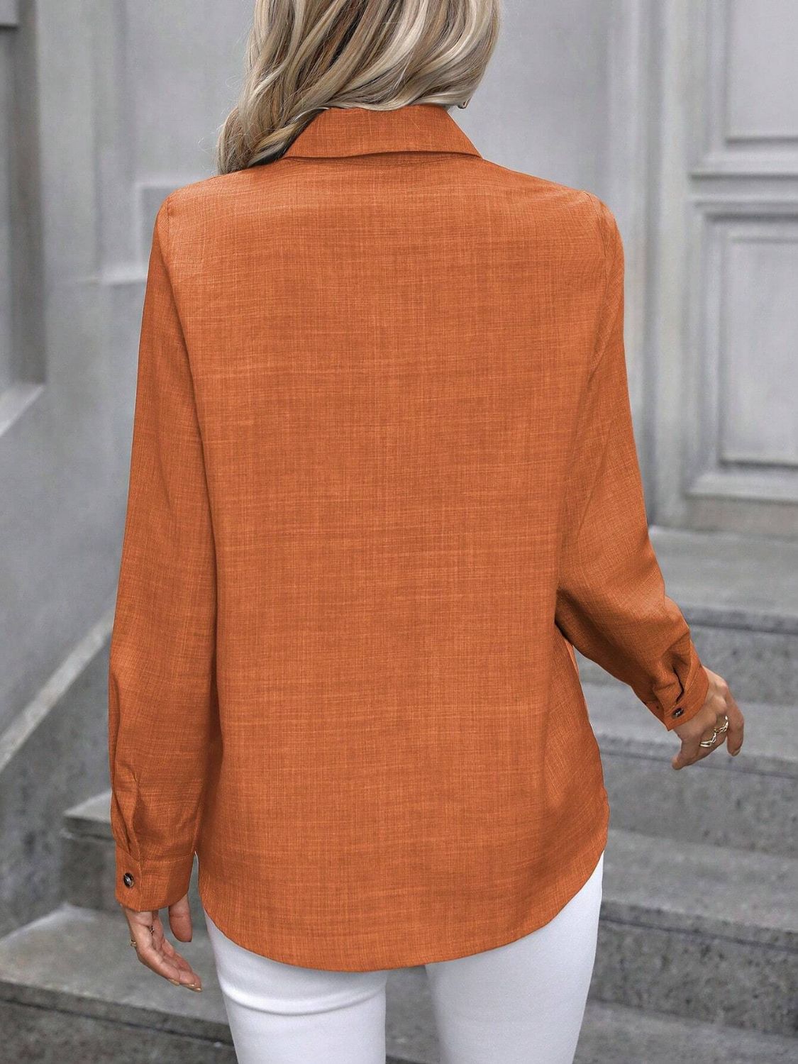Orange linen-blend button-down shirt with long sleeves and button cuffs.