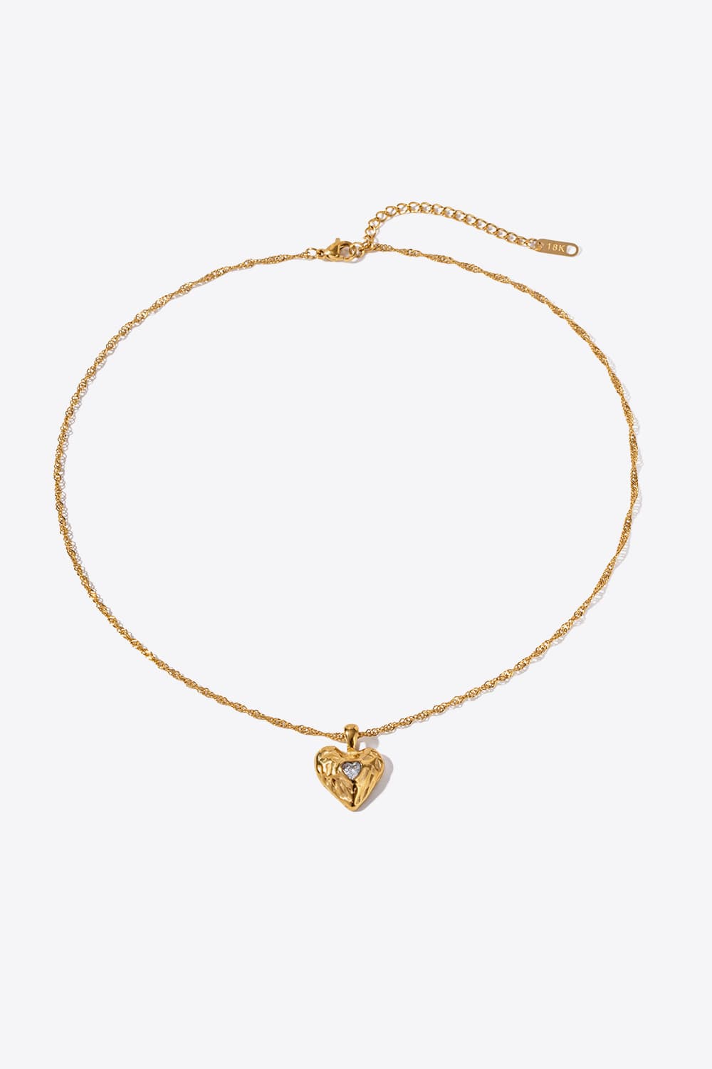 Gold textured heart pendant necklace with diamond accent on delicate chain
