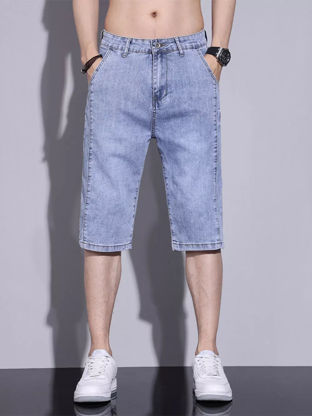 Light blue washed denim shorts for men, classic fit, cotton, buttoned closure.