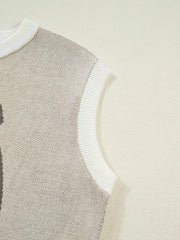 Sleeveless knit vest in beige with white trim and neckline detail.