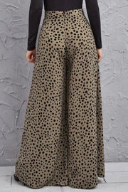 Spotted wide-leg palazzo trousers in dusty pink with a high waist and flowing silhouette.