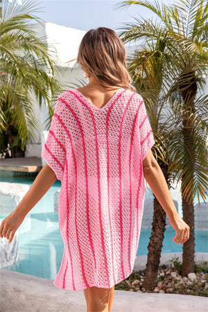 Striped crochet beach cover-up caftan in blush pink with a V-neck and short sleeves.