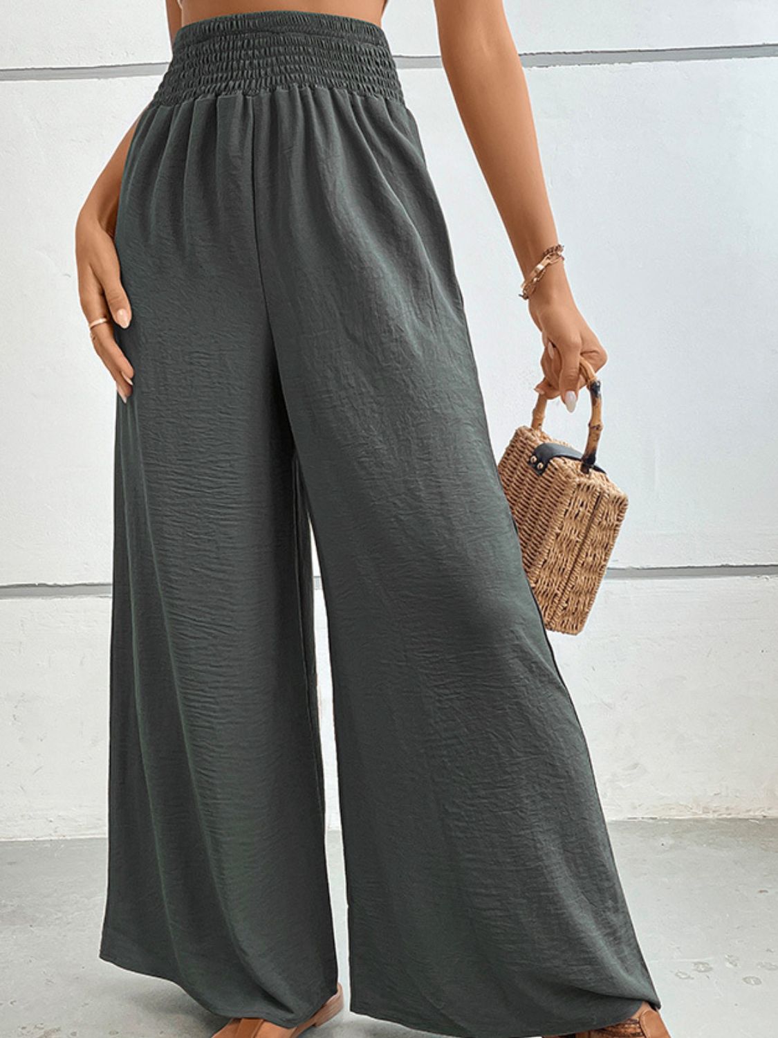 Dark Gray textured smocked waist palazzo maternity trousers with wide legs.