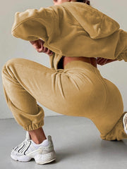 Tan fleece hoodie and jogger set with cinched waist and cuffs.