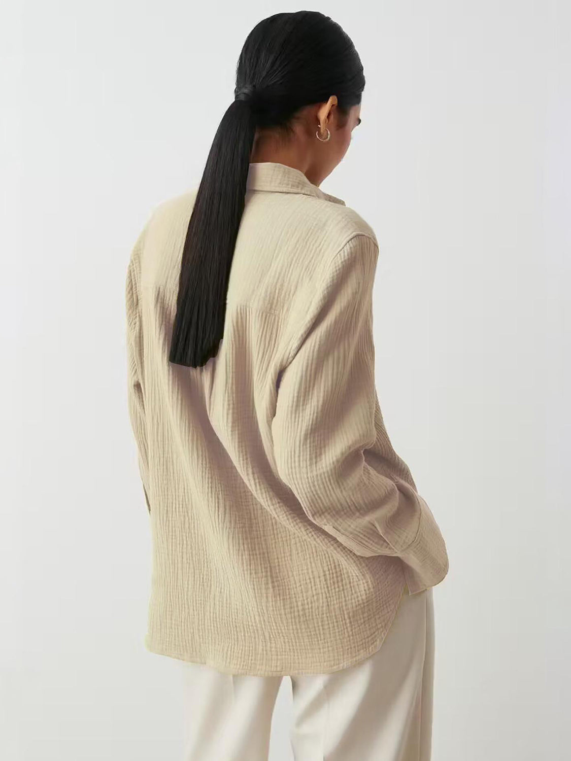 Beige textured cotton overshirt with relaxed fit and collared neckline.