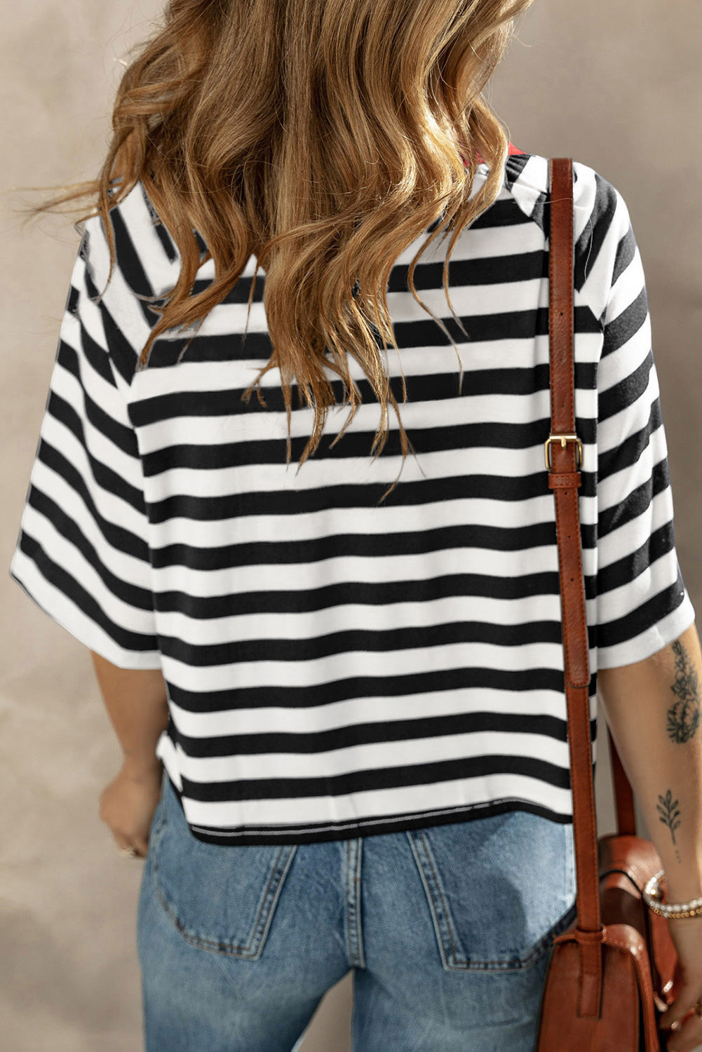 Breton stripe tee with contrast neckline and short sleeves, styled with jeans.