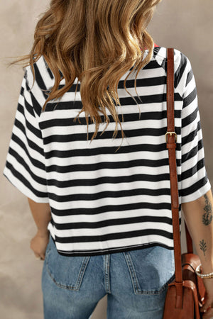 Breton stripe tee with contrast neckline and short sleeves, styled with jeans.