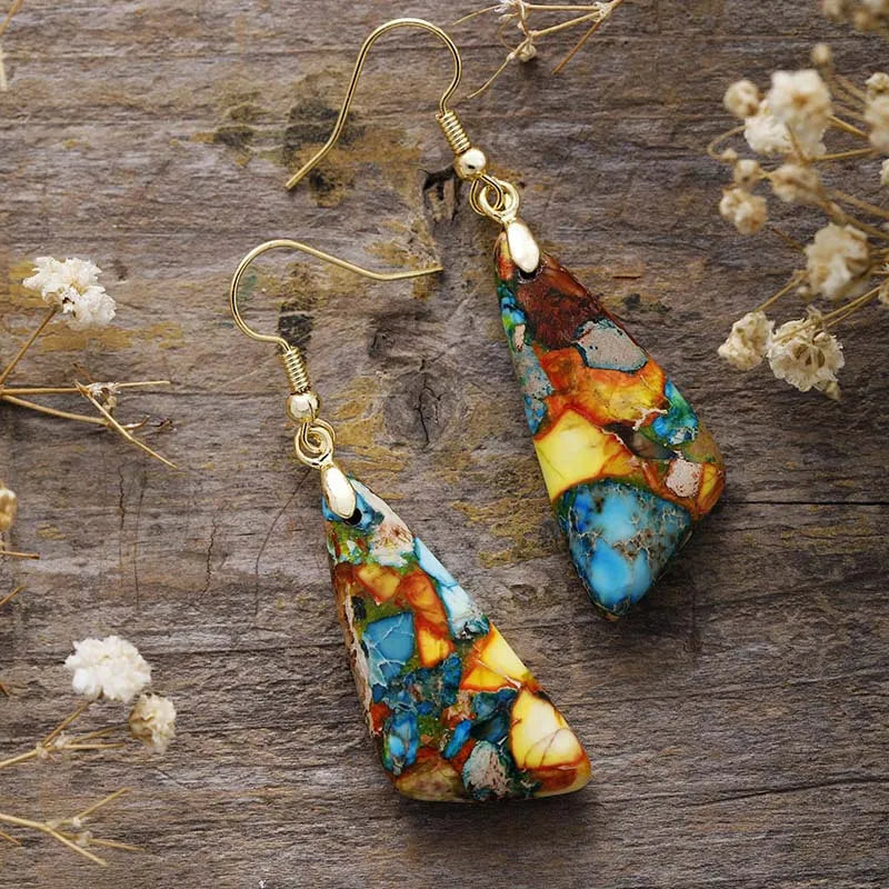 Multicolor stone drop earrings with gold hooks, featuring blue, yellow, orange, and brown natural stone patterns.