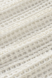 White open-knit acrylic slouchy shoulder cover-up with a relaxed fit.