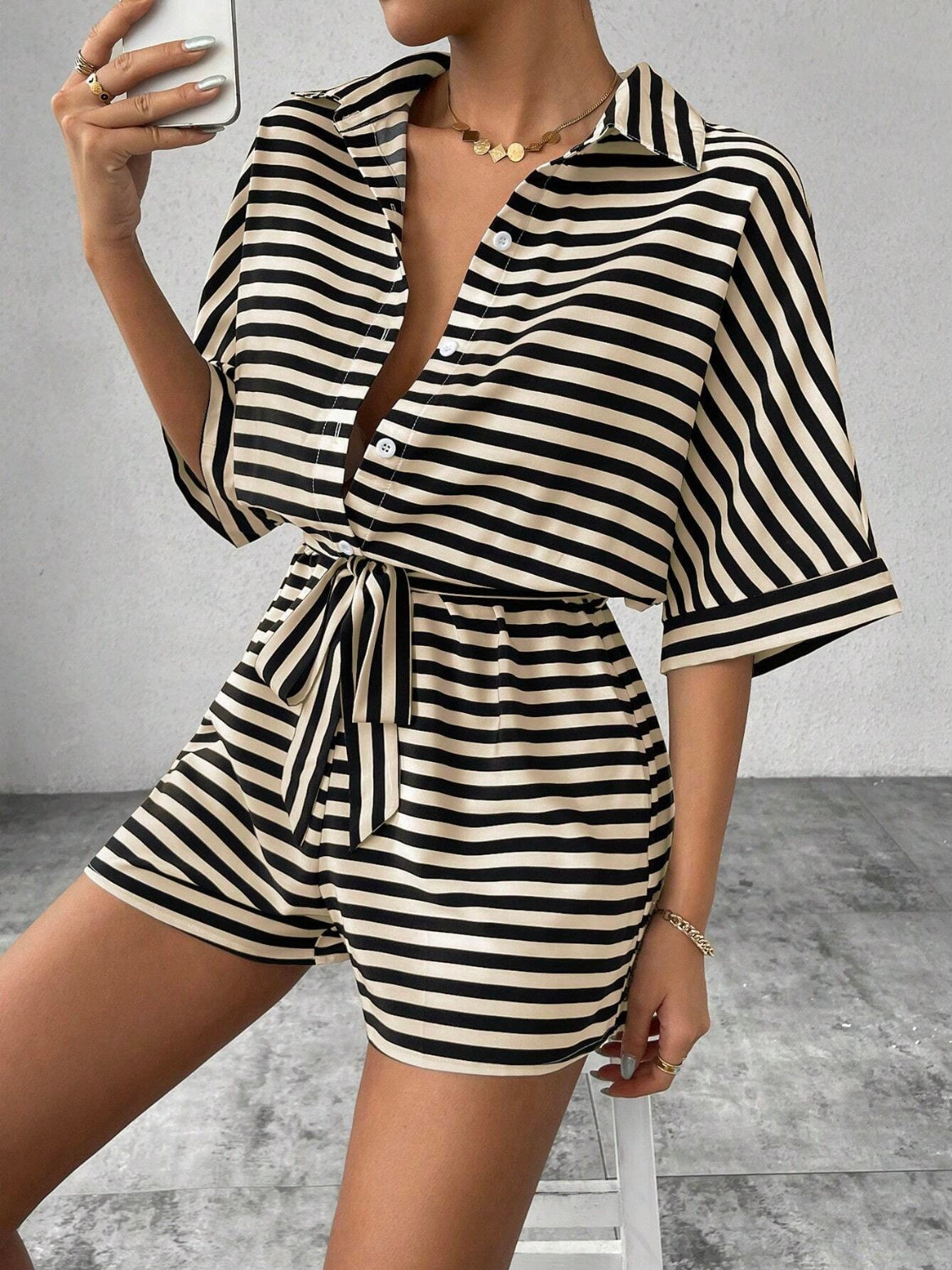 Black and tan striped shirt romper with button front and self-tie belt