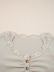 Beige ribbed long-sleeve top with delicate lace trim and button detail.