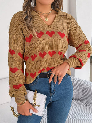 Camel knit polo sweater with red heart pattern and long sleeves.
