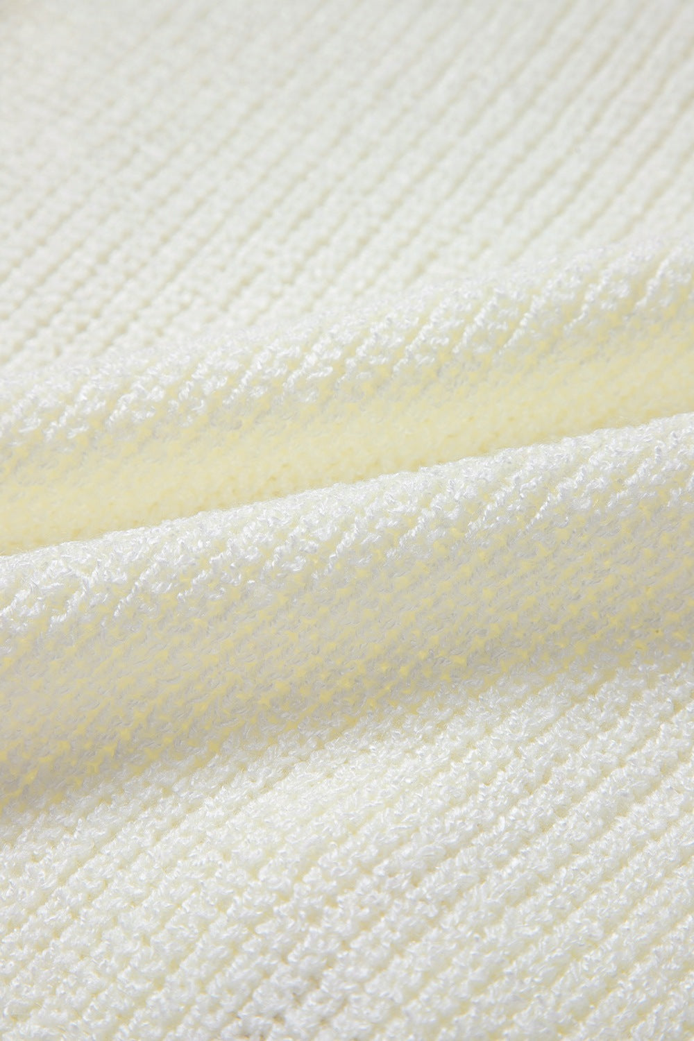 Beige textured knit tank top with a subtle pattern, acrylic fabric.