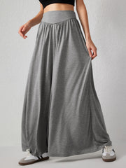 Gray jersey wide-leg trousers with a drape-front and elastic waistband.