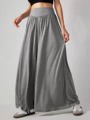 Gray jersey wide-leg trousers with a drape-front and elastic waistband.