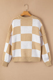Checkerboard knit relaxed crewneck sweater in tan and white with balloon sleeves.