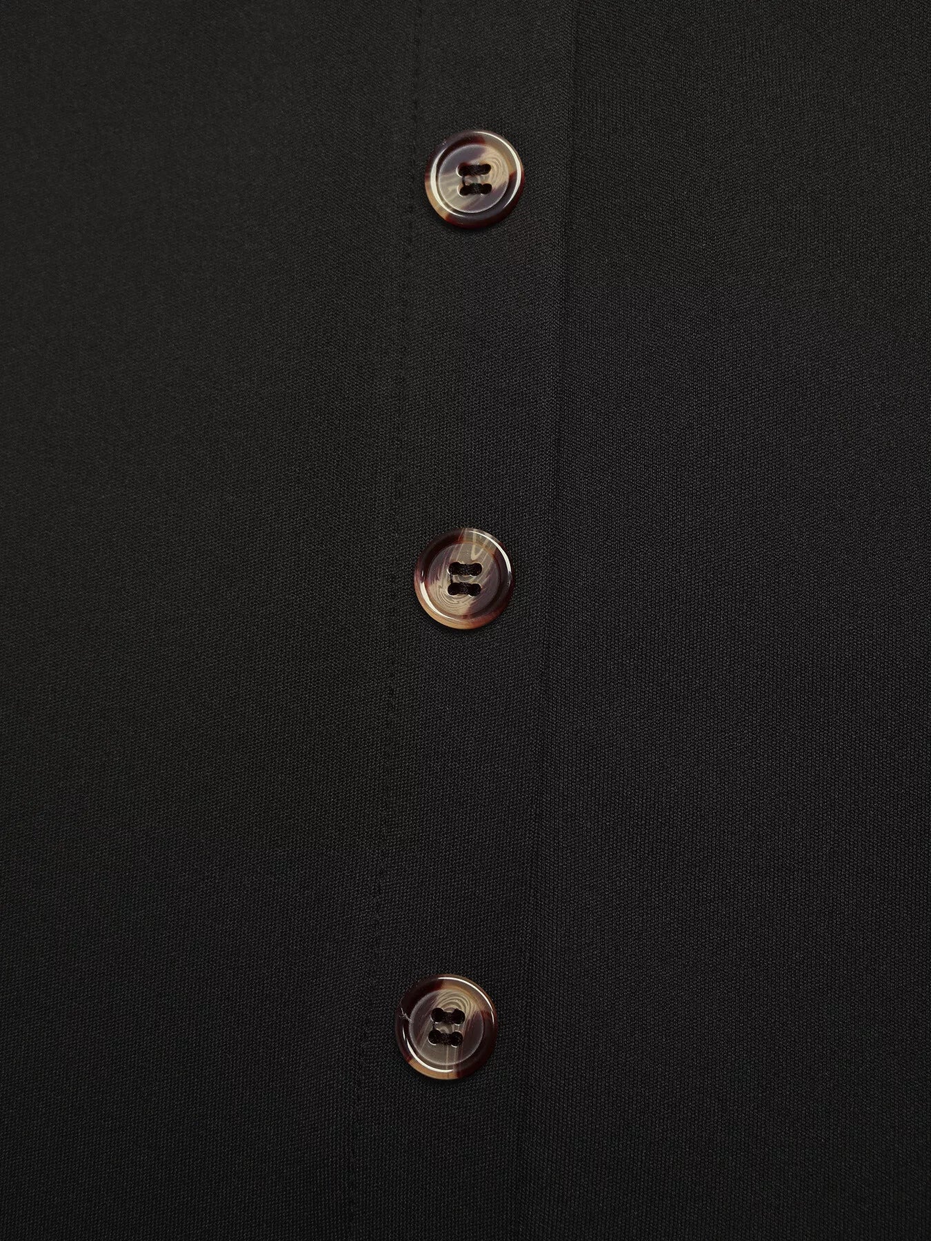 Black midi skirt with tortoise shell button front detail
